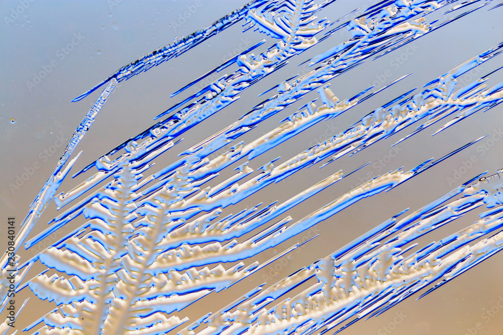 Fototapeta premium Snow patterns on glass as an abstract background