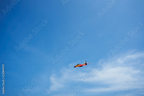 Airplane kite in the air on blue sky background