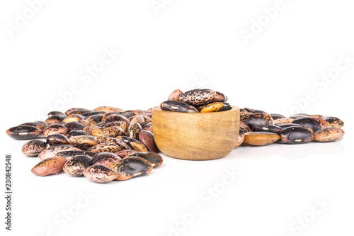 Lot of whole raw speckled colored butter beans painted lady scarlet runner variety with wooden bowl isolated on white background photo