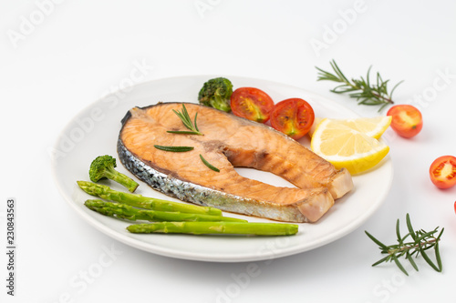 Salmon Grilled on a white plate isolated on white background.