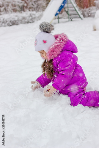 Little kid girl playing in ...