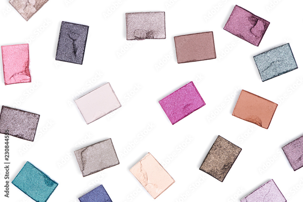 flat lay with arranged various eyeshadows on white backdrop flat lay with arranged various eyeshadows on white backdrop