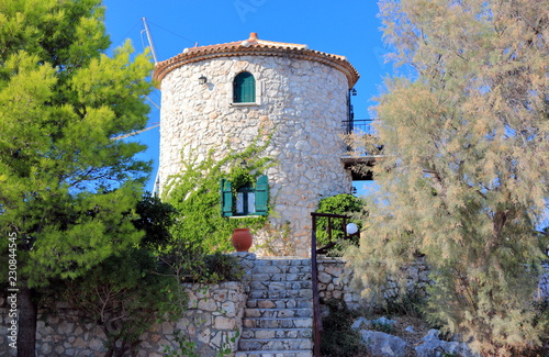 Traditional Windmill in Cape Skinari. North coast of Zakynthos or Zante island, Ionian Sea, Greece. photo