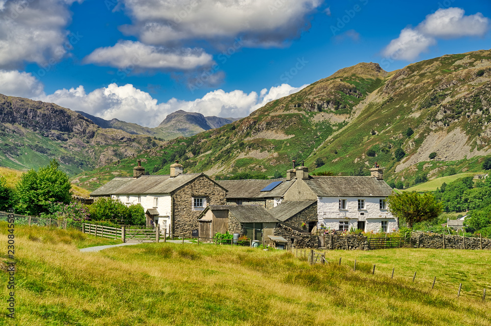 A group of traditional whitwashed cottages in the English Lake District.