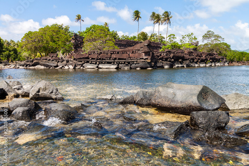 Nan Madol prehistoric ruined stone city. Ancient walls built on coral artificial islands linked by canals in a lagoon of Pohnpei, Micronesia, Oceania photo