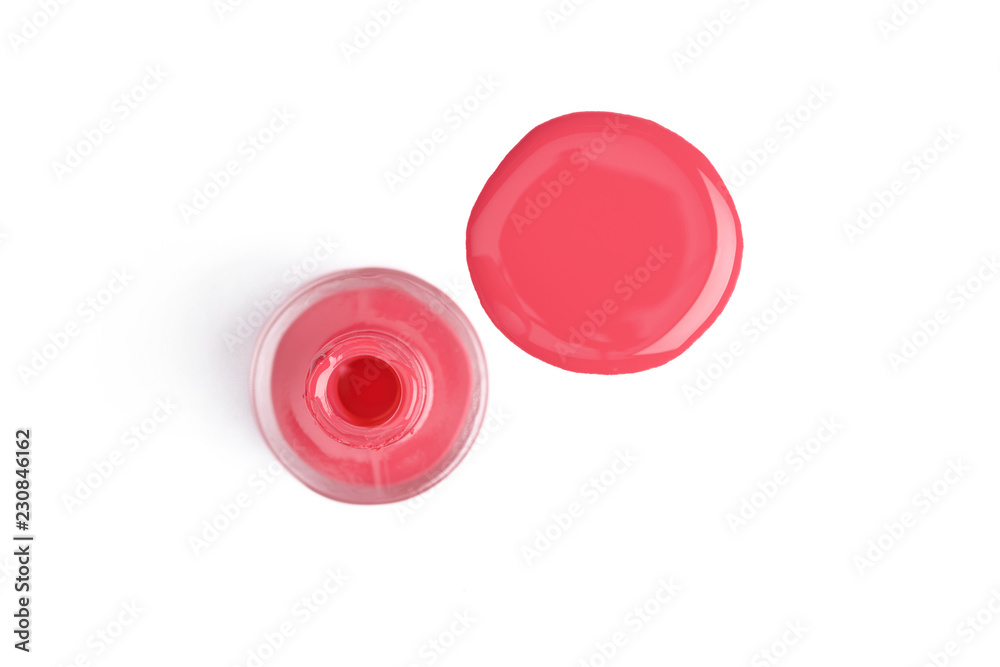 top view of pink nail polish and bottle on white background top view of pink nail polish and bottle on white background