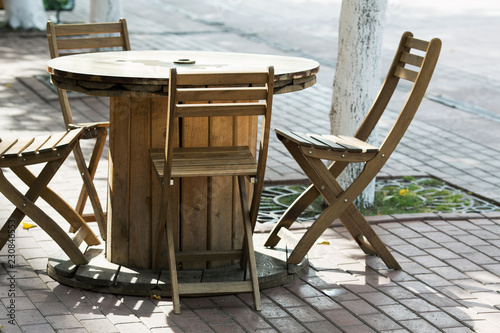 wooden chairs close-up in a street cafe