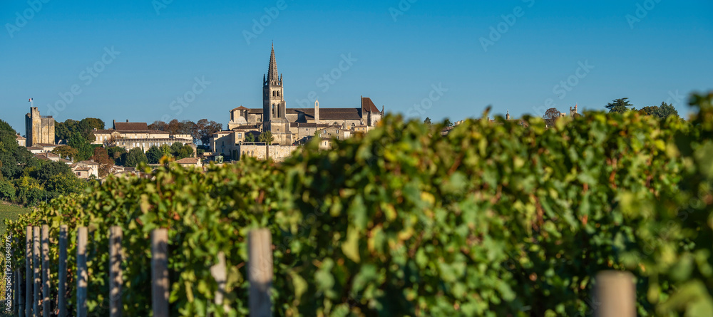 Beautiful sunrise on the steeple of the church and village of Saint Emilion, Religion, Gironde