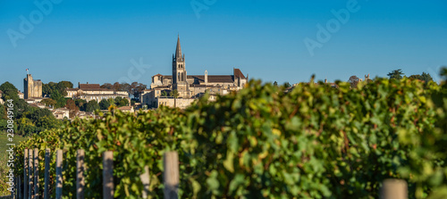 Canvas Print Beautiful sunrise on the steeple of the church and village of Saint Emilion, Rel