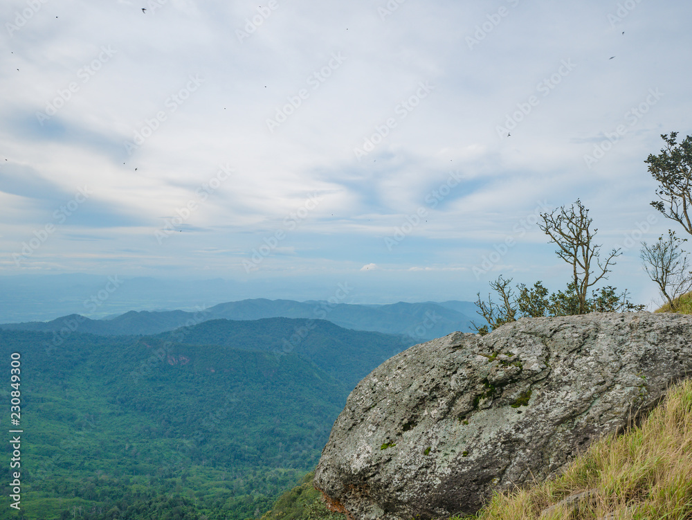 Rocky cliff with beautiful View from Khao Luang mountain in Ramkhamhaeng National Park,Sukhothai province Thailand Rocky cliff with beautiful View from Khao Luang mountain in Ramkhamhaeng National Park,Sukhothai province Thailand