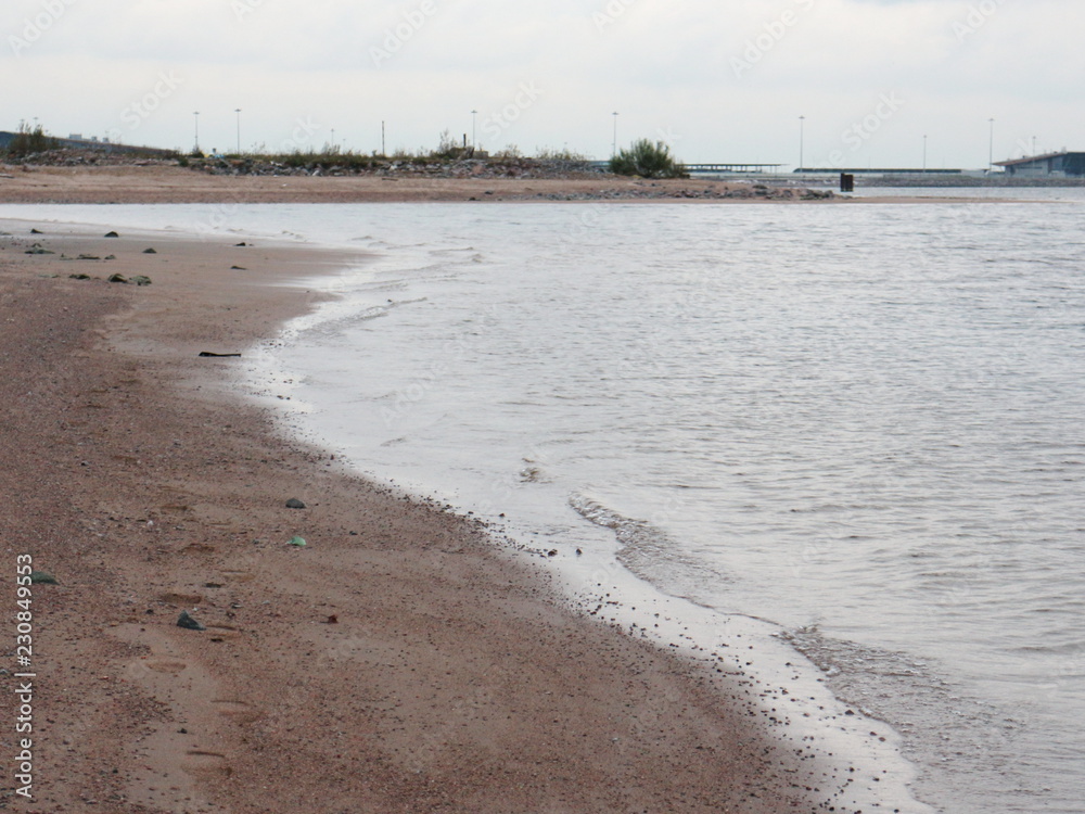 empty sandy beach in cloudy weather empty sandy beach in cloudy weather
