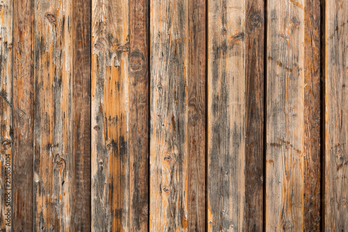 Wood background texture. Brown wooden fence from a pallet. Close up.