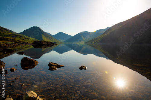 Fototapeta Naklejka Na Ścianę i Meble -  A sunrise view looking down wastwater the lake district, to the great gable and kirk fell