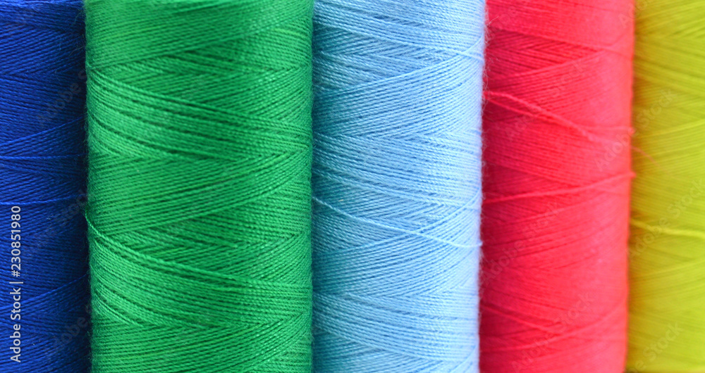 Sewing threads multicolored background closeup Sewing threads multicolored background closeup