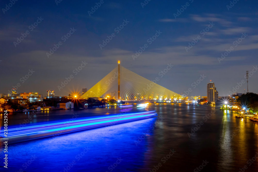 Fototapeta premium Landscape Rama 8 Bridge at night. It is a bridge used for transportation across the Chao Phraya River. The landmark of Bangkok Thailand.