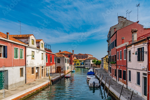 colorful houses on the island of murano near venice in summer