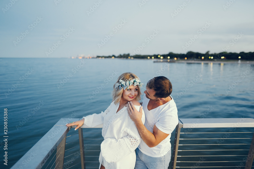 elegant adult couple near sea