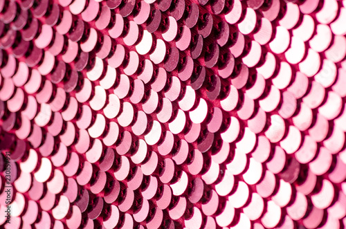 Pink sequins fashion fabric shine on blur background