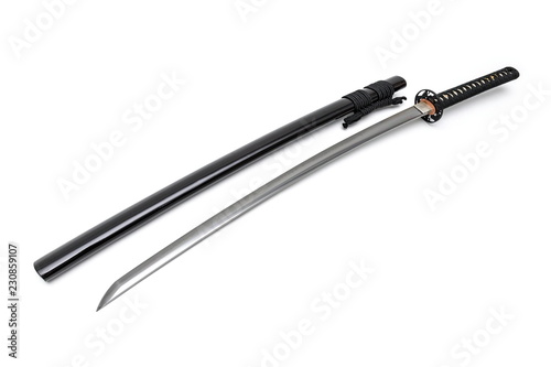 Japanese sword steel fitting and black cord with shiny black scabbard on white background.