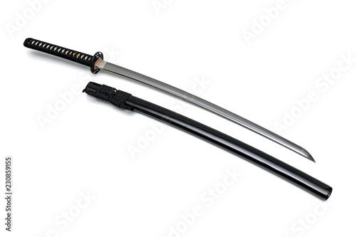 Japanese sword steel fitting and black cord with shiny black scabbard on white background.