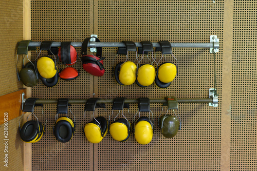 Wall with hearing protection at a shooting gallery