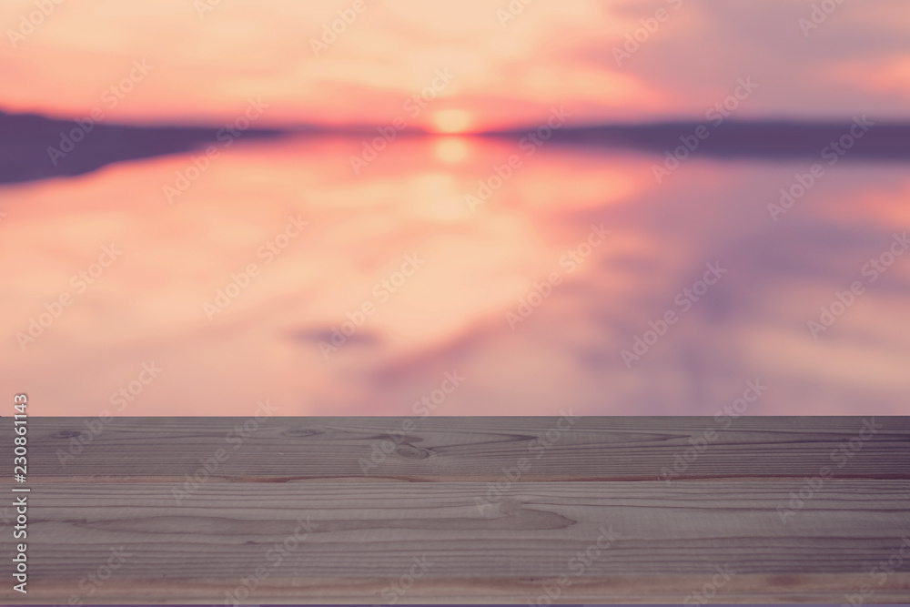 empty table on the sunset lake background