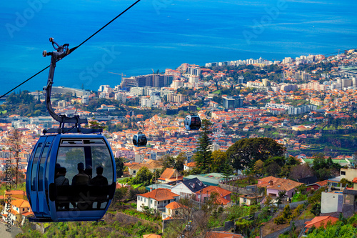 Aerial view of Funchal with traditional cable car above the city, in Madeira island, Portugal photo