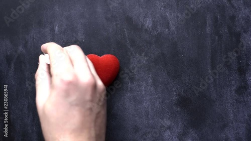 Hand writes with chalk 