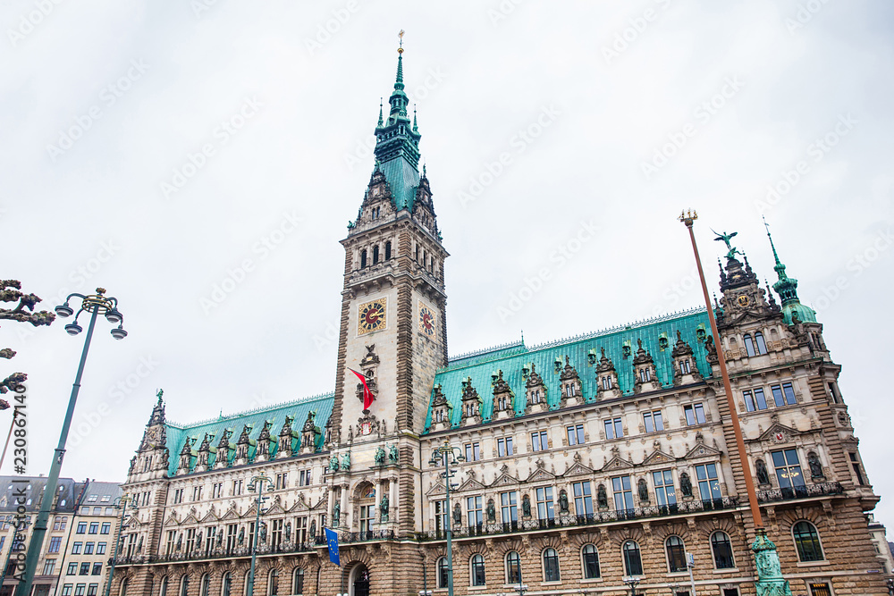 Hamburg City Hall buildiing located in the Altstadt quarter in the city center at the Rathausmarkt square in a cold rainy early spring day