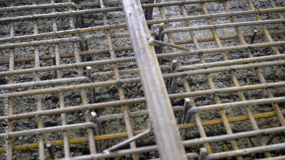A group of builders poured concrete. The foundation of a large construction site, the builders are building a skyscraper or factory A group of builders poured concrete. The foundation of a large construction site, the builders are building a skyscraper or factory
