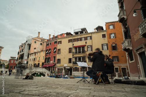 Musician playing on piazza in Venice photo