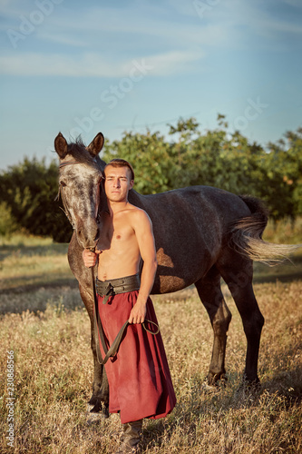 Cossack and his horse. Ukraine. Zaporozhye Sech.