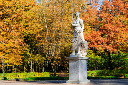 Beautiful autumn landscape in Pavlovsk park with the allegory sculpture Peace with a lion at his feet, Pavlovsk, Saint Petersburg.