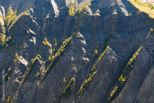 Steep cliff in french alps at summer time photo