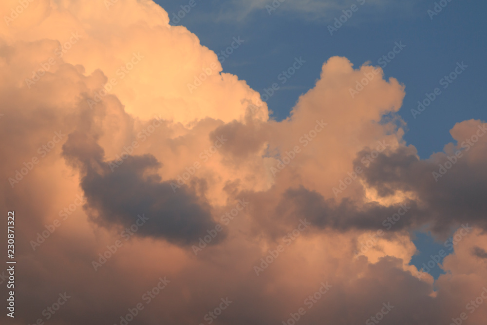 Evening summer clouds closeup. Golden hour