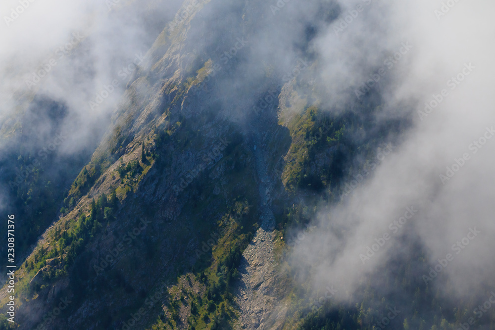 Steep cliff in French alps at summer time