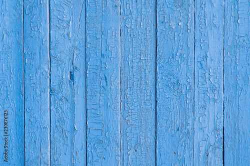 Old wood plank with cracked blue paint background texture