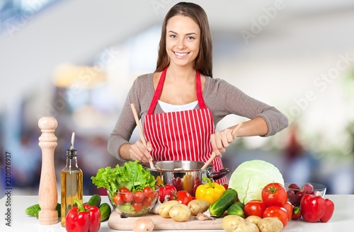 Young beautiful woman Cooking in kitchen © BillionPhotos.com