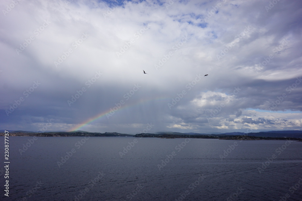 clouds over the sea rainbow