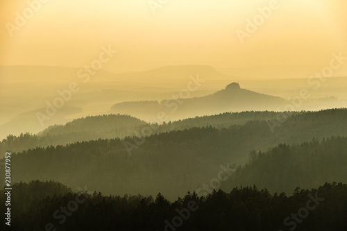 Saxon Switzerland mountains landscape layers in fog, Germany