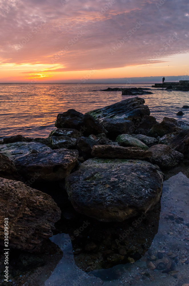 Seascape in Odesa during the sunrise in the autumn season Seascape in Odesa during the sunrise in the autumn season