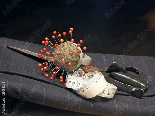 Pincushion, scissors and measuring tape in tailoring
 photo