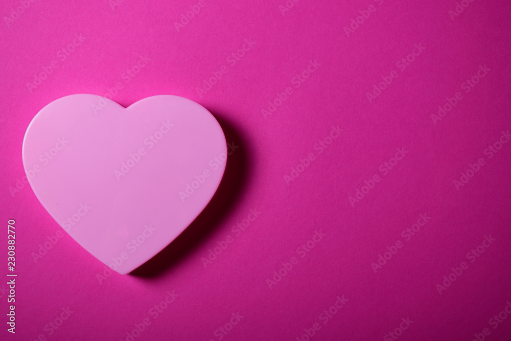 Beautiful pink heart on gradient magenta background.