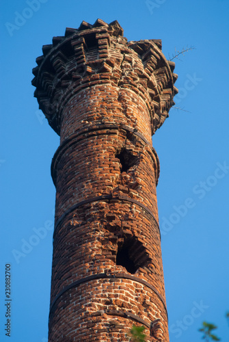 Old alcohol distillery chimney in Escobar. This chimney was used by Argentinean rock climbers during the 1950s for training purposes photo