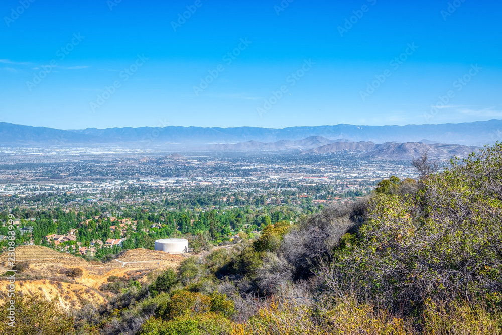 Foothills above the suburbs of inland area California with blue sky for copy text