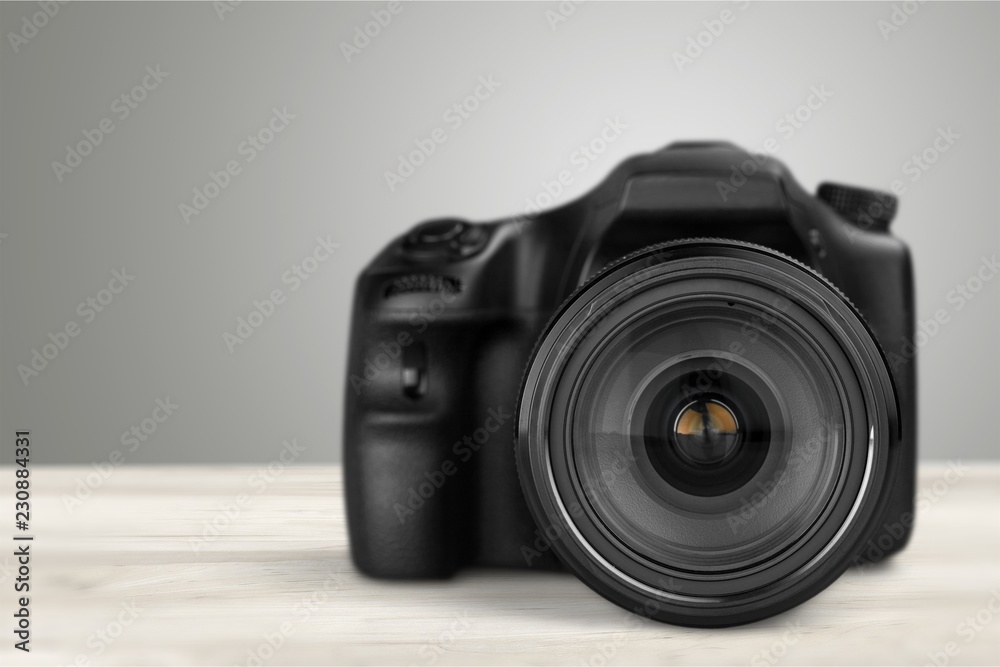 Black camera isolated on white background