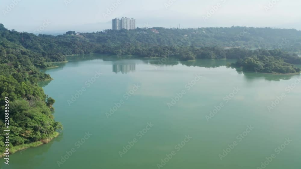 Drone flyover a peaceful lake in the morning, Renyitan Reservoir, Taiwan, Aisa Drone flyover a peaceful lake in the morning, Renyitan Reservoir, Taiwan, Aisa