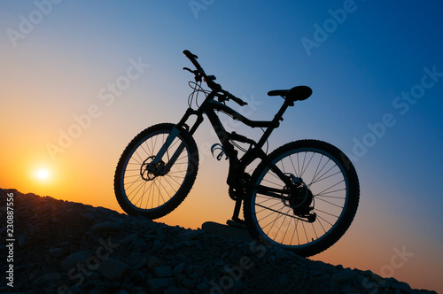 Silhouette of mountain bicycle at sunset