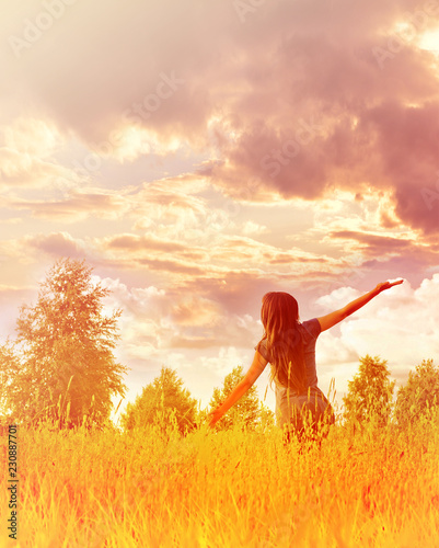 Happy woman enjoying happiness, freedom and nature.
