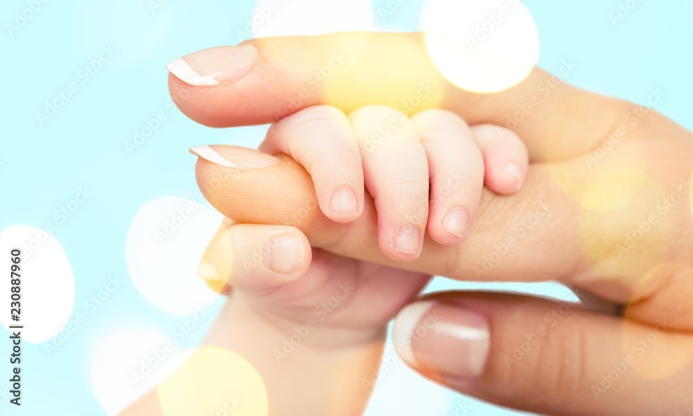 Close up photo of father holding baby hand Close up photo of father holding baby hand